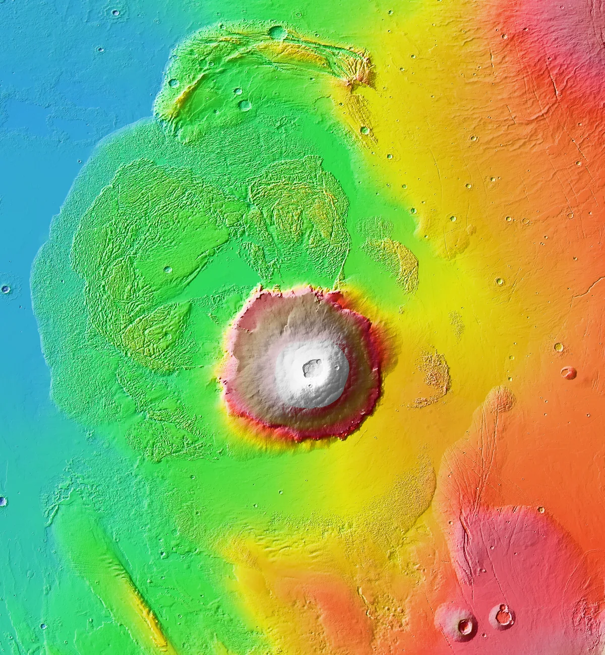 Colorized topographic map of Olympus Mons, a broad circular volcano rising from blue-grey plains.